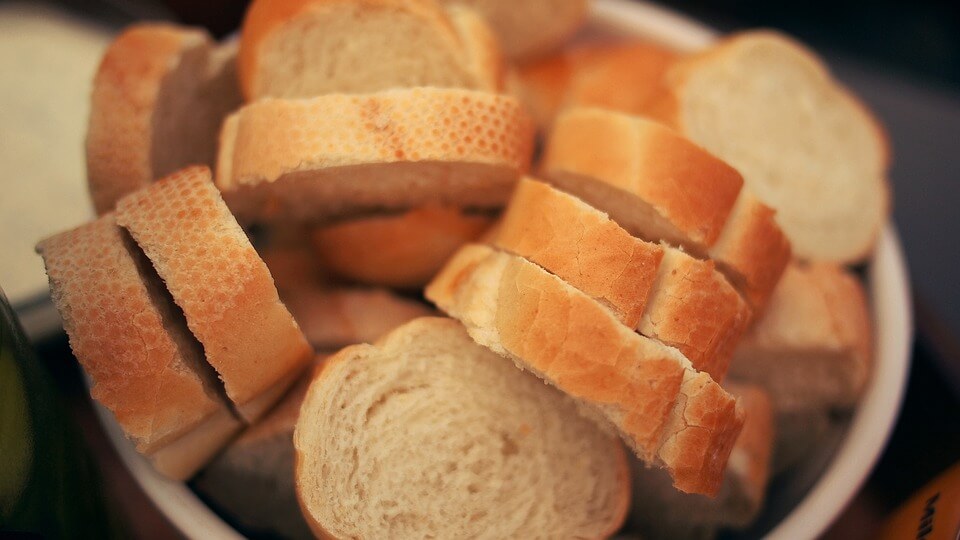 Sliced loaves of pale golden gluten-free bread